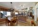 Well-lit kitchen featuring stainless steel appliances, a center island and an adjacent dining area at 16424 N 1St Dr, Phoenix, AZ 85023