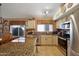 Spacious kitchen with granite countertops, stainless steel appliances, and natural lighting at 16424 N 1St Dr, Phoenix, AZ 85023