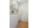 Functional laundry room with tile floors, a washer and dryer, storage cabinets, and access to an exterior door at 16424 N 1St Dr, Phoenix, AZ 85023
