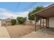 Large backyard with citrus trees, covered patio, and brick barbeque at 16833 N 17Th Pl, Phoenix, AZ 85022