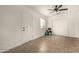 Versatile room with neutral tile flooring, ceiling fan, and ample lighting at 16833 N 17Th Pl, Phoenix, AZ 85022