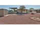 Residential home with a low-maintenance backyard, storage shed, and convenient covered parking at 17244 N 66Th Ln, Glendale, AZ 85308