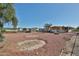 Spacious backyard features low maintenance gravel landscaping and an outbuilding for extra storage at 17244 N 66Th Ln, Glendale, AZ 85308