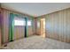 A well-lit bedroom with a window for natural light and a doorway to an en-suite bath at 17244 N 66Th Ln, Glendale, AZ 85308