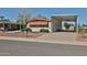 Charming desert home featuring covered parking, low-maintenance rock landscaping and mature shade tree at 17244 N 66Th Ln, Glendale, AZ 85308