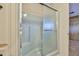 Features of a standing shower in a dedicated shower room, which includes the shower apparatus and door at 17244 N 66Th Ln, Glendale, AZ 85308
