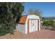 Backyard image featuring a storage shed, greenery, and blue skies at 17244 N 66Th Ln, Glendale, AZ 85308