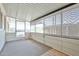 An enclosed sun room, carpeted, and screened, offering a versatile space for relaxation and entertainment at 17244 N 66Th Ln, Glendale, AZ 85308