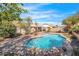 Serene backyard with a pool and mature trees, perfect for outdoor living at 17631 N 42Nd Dr, Glendale, AZ 85308