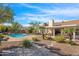 Beautiful backyard featuring a pool, mature trees, and patio at 17631 N 42Nd Dr, Glendale, AZ 85308