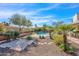 Lush backyard featuring a private pool and stone landscaping at 17631 N 42Nd Dr, Glendale, AZ 85308