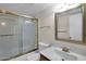 Bathroom with glass shower door, gold hardware and granite countertop at 17631 N 42Nd Dr, Glendale, AZ 85308