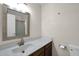 Bathroom featuring speckled countertop and a large mirror at 17631 N 42Nd Dr, Glendale, AZ 85308