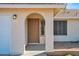 Inviting front entrance with a arched entryway, and a lovely wood door at 17631 N 42Nd Dr, Glendale, AZ 85308