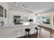 Bright kitchen featuring stainless steel appliances, white cabinets and a center island with bar stool seating at 17631 N 42Nd Dr, Glendale, AZ 85308