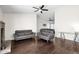 Spacious living room featuring hardwood floors and a stylish grey sofa set at 17631 N 42Nd Dr, Glendale, AZ 85308