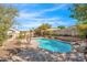Tranquil pool area featuring a lush garden and mature trees at 17631 N 42Nd Dr, Glendale, AZ 85308