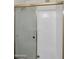 Bright bathroom featuring glass shower door and tile walls at 17631 N 42Nd Dr, Glendale, AZ 85308