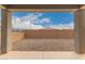 Expansive backyard featuring view of the property boundary with low maintenance desert landscaping at 17845 W Red Fox Rd, Surprise, AZ 85387