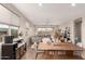 Well-lit dining room with views to the living room and backyard at 17845 W Red Fox Rd, Surprise, AZ 85387