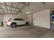 A spacious three car garage with epoxy floor, insulated door and high ceilings at 17845 W Red Fox Rd, Surprise, AZ 85387