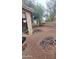 Spacious backyard showing a partial view of the house and some equipment and tools at 18293 W Elm St, Surprise, AZ 85388