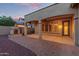 Outdoor living space with a cozy fireplace and manicured landscaping at 21008 W Cora Vis, Buckeye, AZ 85396