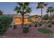 Lush backyard featuring mature landscaping and a partial view of the home's exterior at 21008 W Cora Vis, Buckeye, AZ 85396