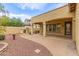 Secluded backyard featuring a fireplace, lush landscaping, and hardscape at 21008 W Cora Vis, Buckeye, AZ 85396