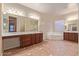 Bright bathroom boasts dual sinks, a soaking tub, and a separate shower at 21008 W Cora Vis, Buckeye, AZ 85396