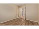 Unfurnished bedroom featuring wood-look floors and neutral walls offers a blank canvas for personalization at 21008 W Cora Vis, Buckeye, AZ 85396