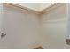 Walk-in closet with ample storage space, featuring shelves and a hanging rod for organized living at 21008 W Cora Vis, Buckeye, AZ 85396