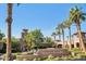Verrado Golf Club features lush landscaping, palm trees and Spanish architecture at 21008 W Cora Vis, Buckeye, AZ 85396