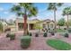 Charming front yard landscaped with mature trees, colorful shrubs, and manicured lawn at 21008 W Cora Vis, Buckeye, AZ 85396