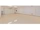 Spacious and well lit three car garage with epoxy floors and a side door at 21008 W Cora Vis, Buckeye, AZ 85396
