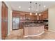 Modern kitchen with an island, stainless steel appliances, and ample cabinet storage at 21008 W Cora Vis, Buckeye, AZ 85396