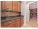 Gourmet kitchen with granite counters, custom cabinetry, and stainless steel appliances at 21008 W Cora Vis, Buckeye, AZ 85396