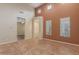 Spacious living room with tall ceilings and tile flooring, perfect for entertaining guests at 21008 W Cora Vis, Buckeye, AZ 85396