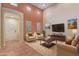 Bright living room with high ceilings, neutral paint, and comfortable seating at 21008 W Cora Vis, Buckeye, AZ 85396