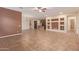 Expansive living room with a neutral palette and tiled floors, perfect for entertaining and relaxation at 21008 W Cora Vis, Buckeye, AZ 85396