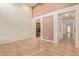 Open-concept living room showcasing neutral tones and easy access to the kitchen and hallway at 21008 W Cora Vis, Buckeye, AZ 85396