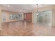 Open concept living room with large windows, tiled flooring, and natural light creates an inviting atmosphere at 21008 W Cora Vis, Buckeye, AZ 85396