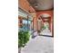 Charming storefront features brick facade, large windows and inviting outdoor seating at 21008 W Cora Vis, Buckeye, AZ 85396