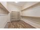 Walk-in closet equipped with custom shelving and ample storage space at 21008 W Cora Vis, Buckeye, AZ 85396