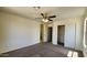 Large bedroom with closet, ceiling fan and neutral carpeting at 2143 N 30Th St, Mesa, AZ 85213