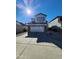 Charming two-story home with a well-maintained front yard and attached two-car garage under a bright, sunny sky at 2143 N 30Th St, Mesa, AZ 85213