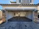 A spacious, empty two-car garage with stone accents and ample storage space, ready for your vehicles and projects at 2143 N 30Th St, Mesa, AZ 85213