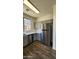 Updated kitchen features stainless steel appliances and gray cabinets at 2143 N 30Th St, Mesa, AZ 85213