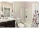 Well-maintained bathroom featuring a shower-tub combination, vanity, and a large mirror, providing a functional space at 22552 E Via Estancia --, Queen Creek, AZ 85142