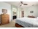 Inviting bedroom featuring a dresser and access to an en-suite bathroom at 22552 E Via Estancia --, Queen Creek, AZ 85142